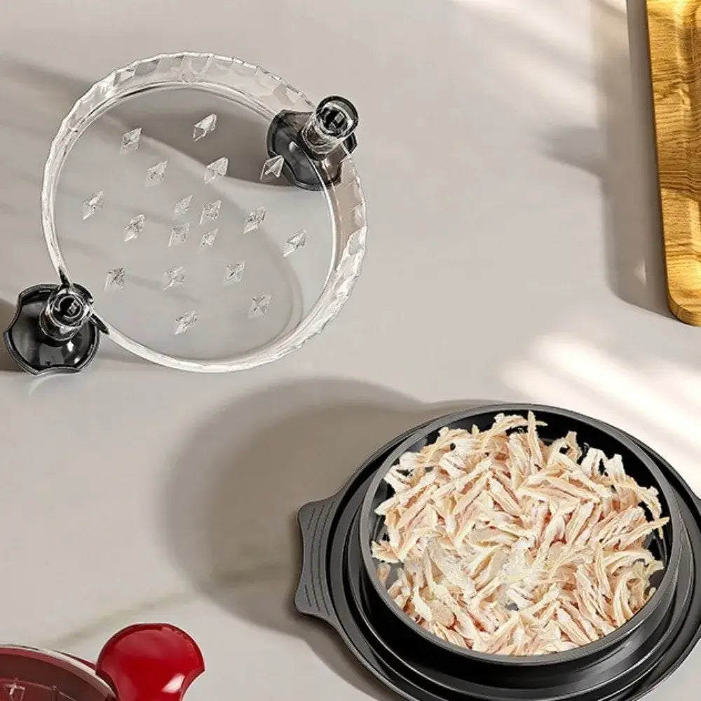 Manual Meat Shredder for Chicken and Beef with shredded chicken in a bowl.