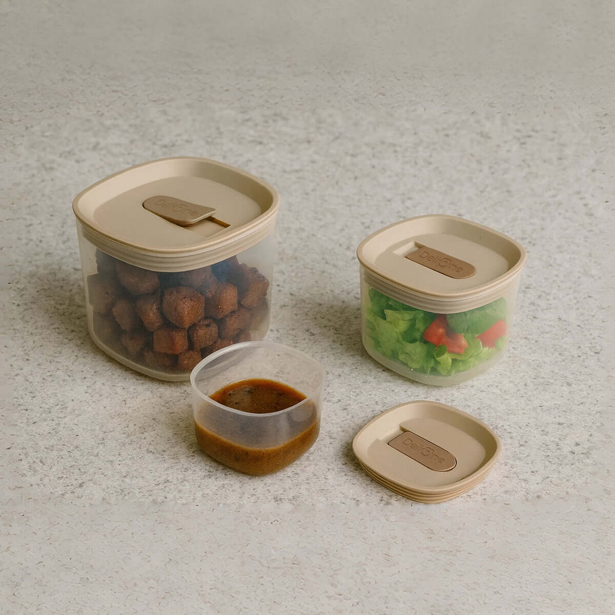 Set of glass meal prep containers with airtight silicone vent lids.