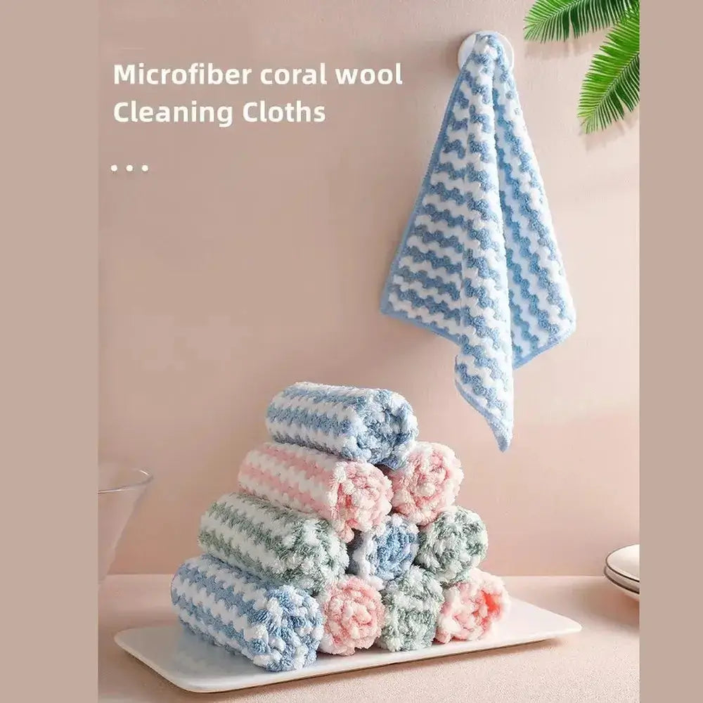 Eco-friendly microfiber dishcloths stacked neatly with a hanging cloth, perfect for efficient kitchen cleaning.
