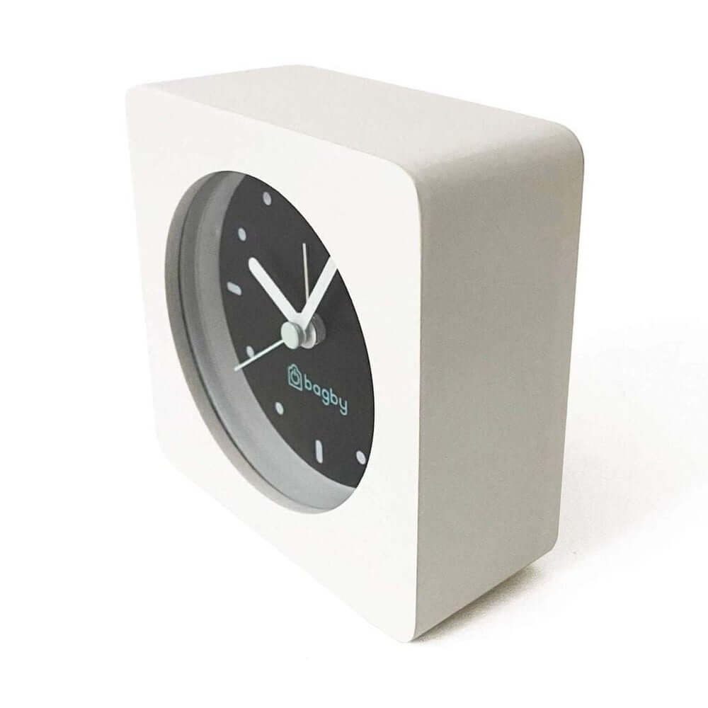 Silent wooden alarm clock featuring minimalist design and quiet movement for peaceful mornings.