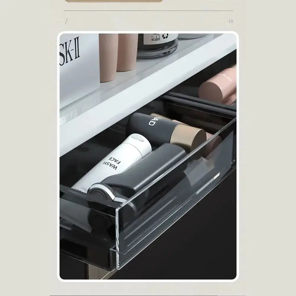 No-drill bathroom organizer shelf in use with toiletries and beauty products neatly arranged in a clear storage drawer.