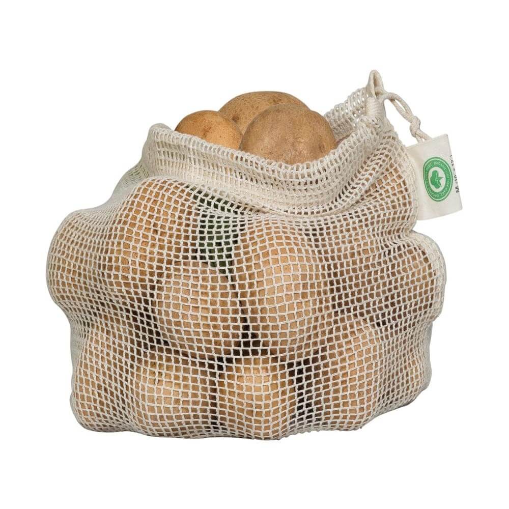 Organic cotton produce bags filled with fresh potatoes, ideal for sustainable shopping.