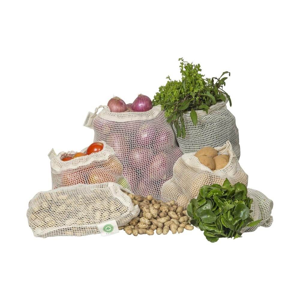 Organic cotton produce bags filled with fruits, vegetables, and nuts in reusable mesh design.