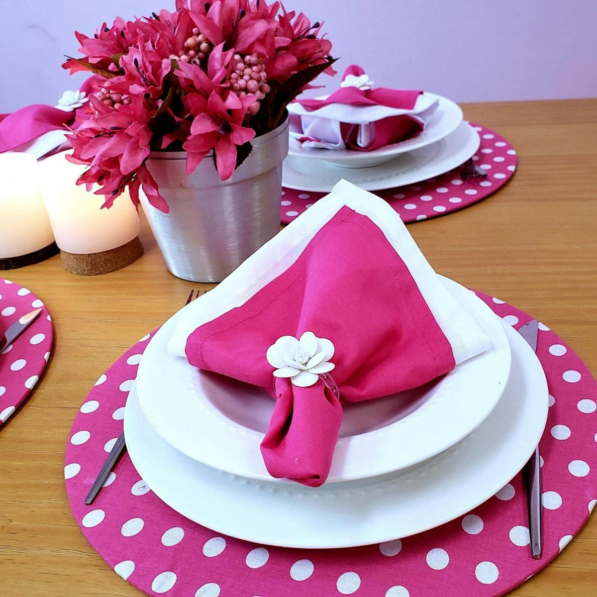 Set of four pink polka dot placemats in soft natural cotton.