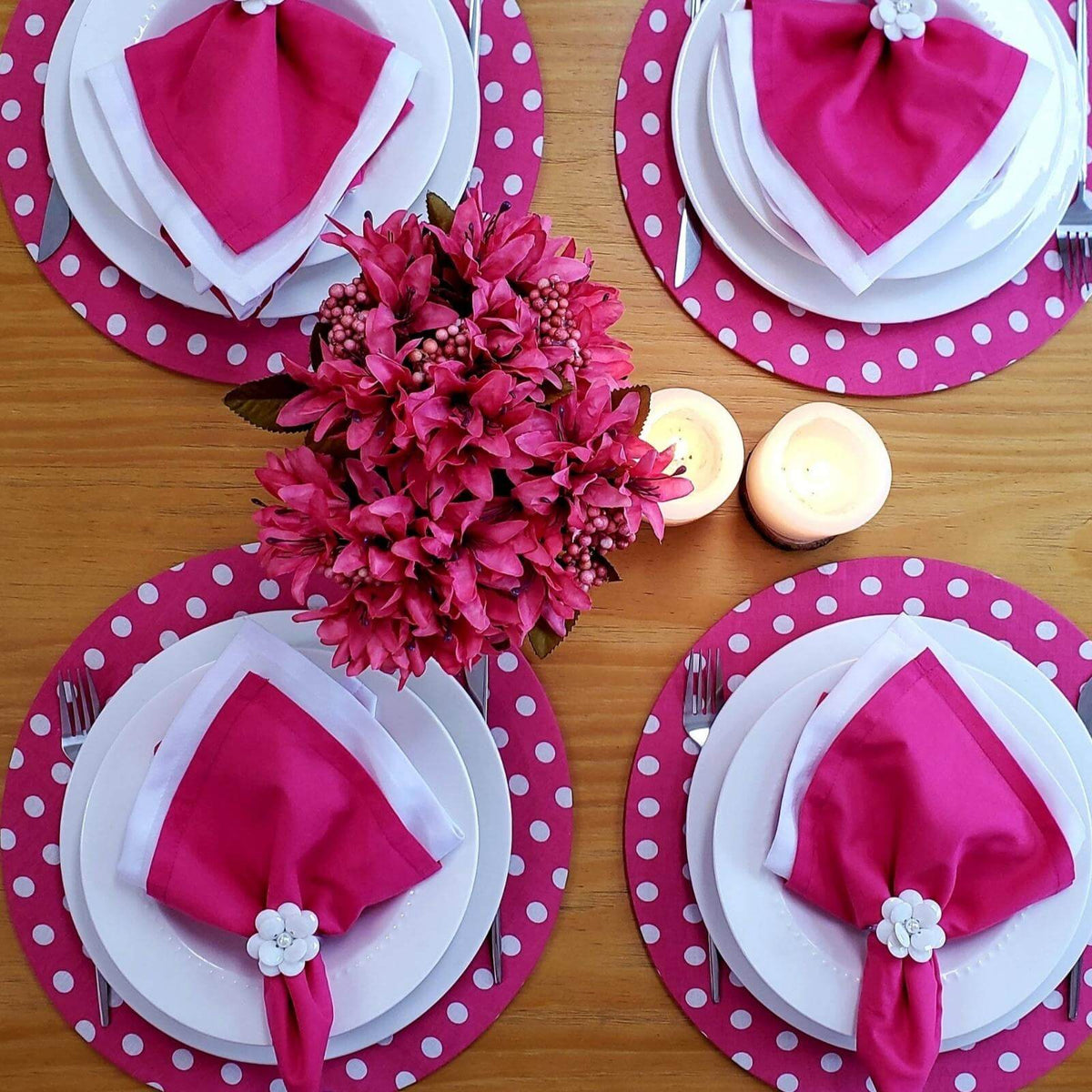 Set of four pink polka dot placemats in soft natural cotton.