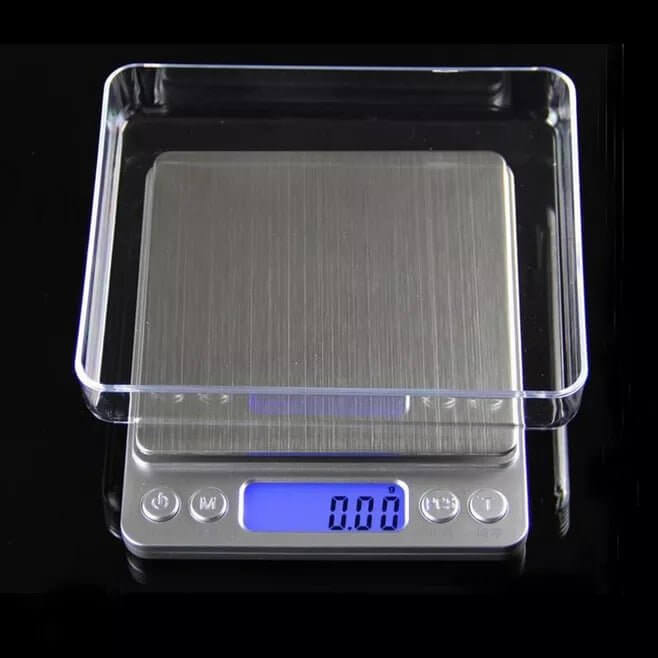 Precision digital kitchen scale with 0.1g readability and a tare function.