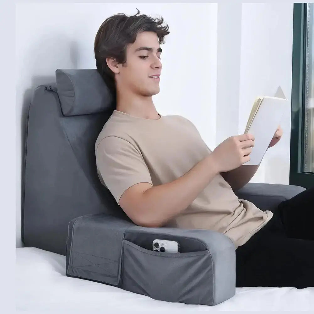 Reading pillow with armrests styled on a bed as a finished bedroom accent