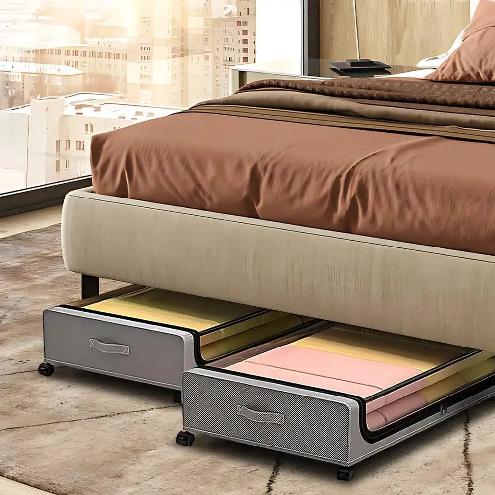 Rolling under-bed storage bins under a bed, featuring a clear window and wheels for easy access.