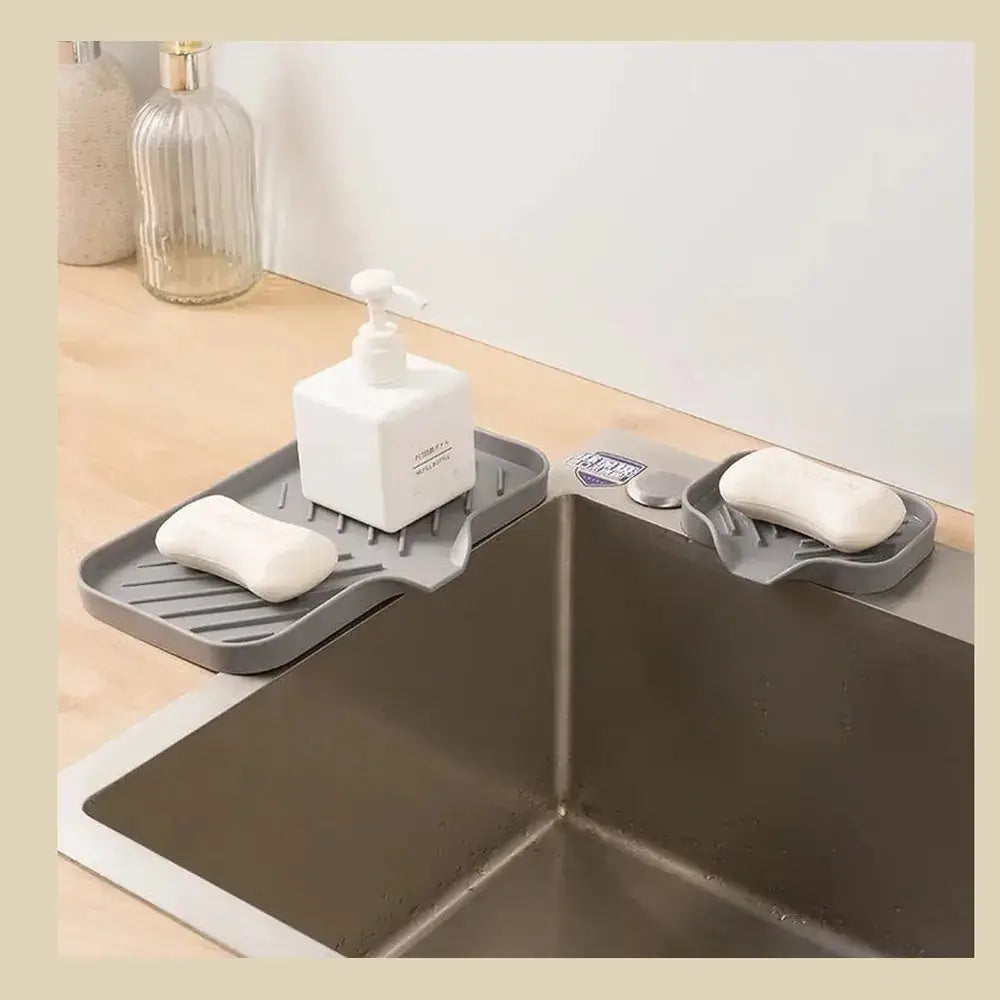 Silicone auto-draining sponge holder displayed by the sink, enhancing kitchen organization with a stylish design.
