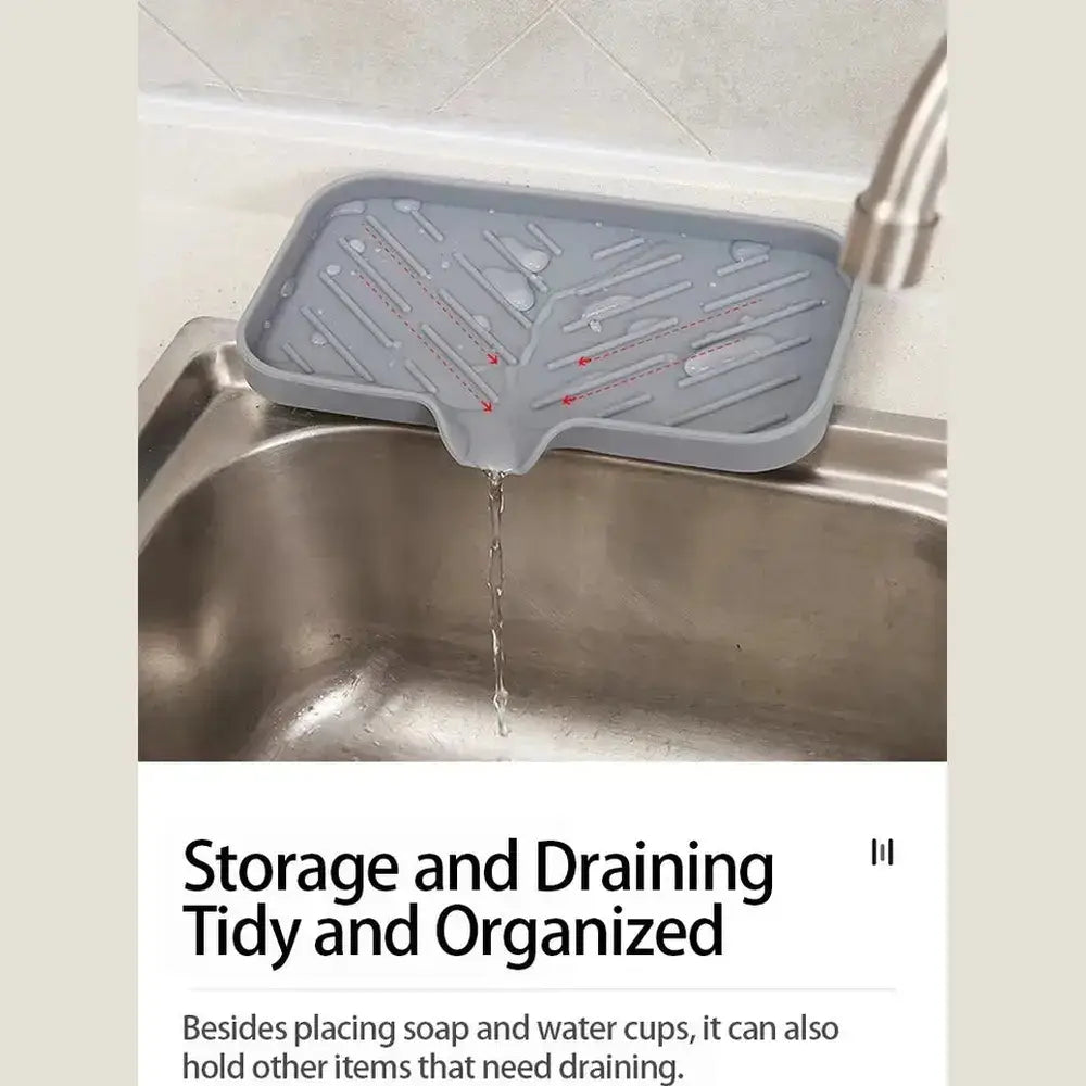 Silicone auto-draining sponge holder in kitchen sink, enabling tidy storage and effective drainage.