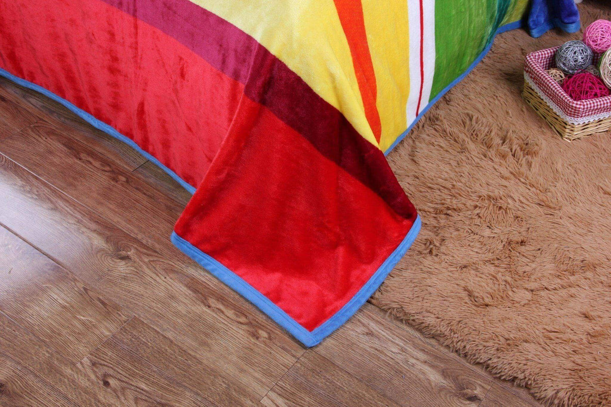 Colorful striped rainbow reversible plush fleece throw blanket.
