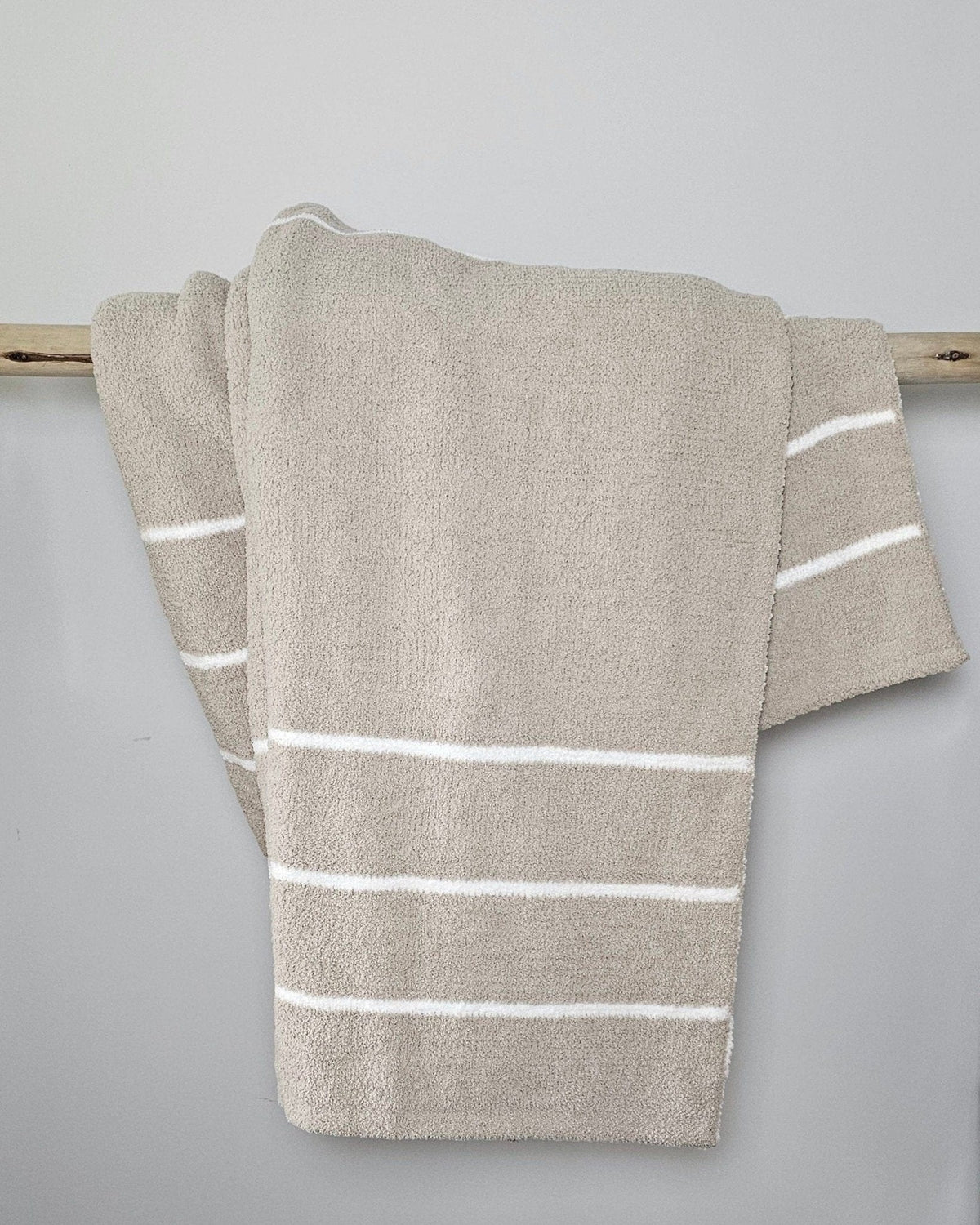 Ultra-plush oversized throw blanket in warm grey stripe