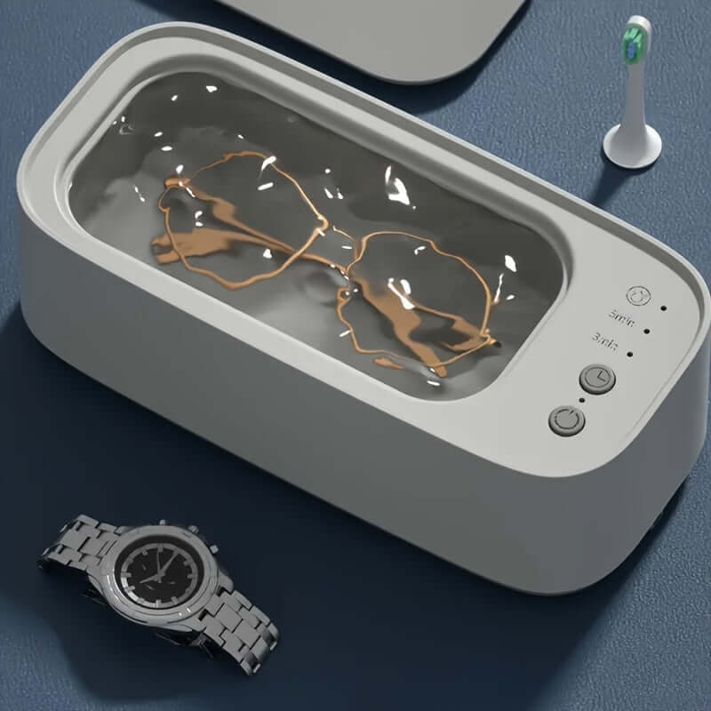 Compact ultrasonic jewelry cleaner for jewelry, glasses, and watches.