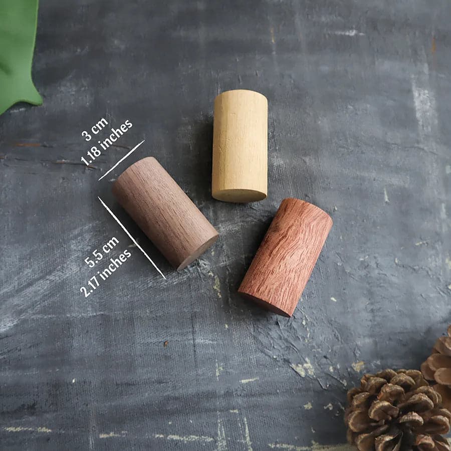 Portable essential oil diffuser with a natural wooden design for aromatherapy on the go.