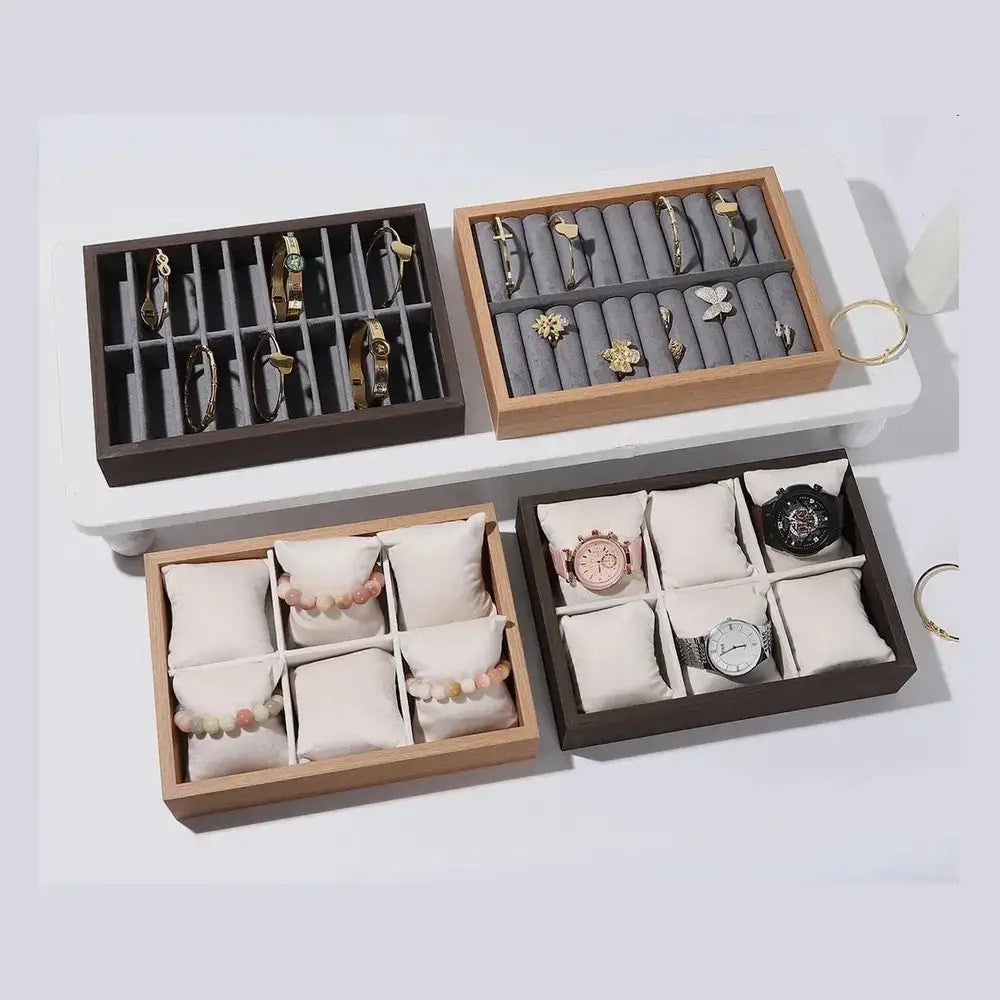Wooden velvet jewelry tray organizer filled with rings, earrings, and bracelets.